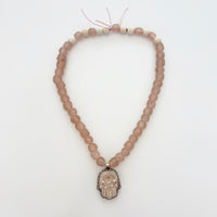 Talisman Necklace - Glass Hamsa necklace alternate angle view 1, detailed close-up